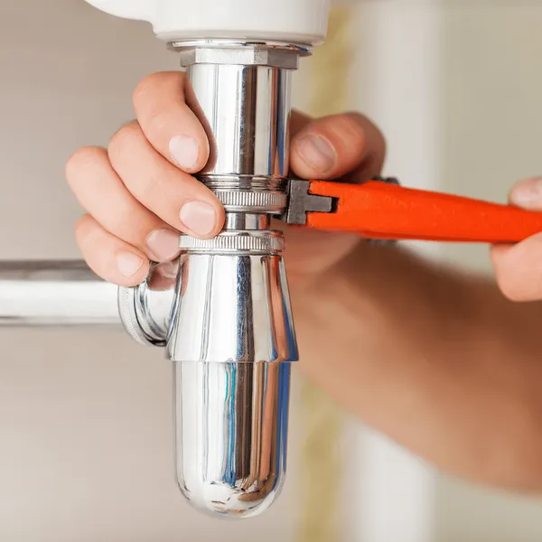 Rooter service clearing a blocked sewer line